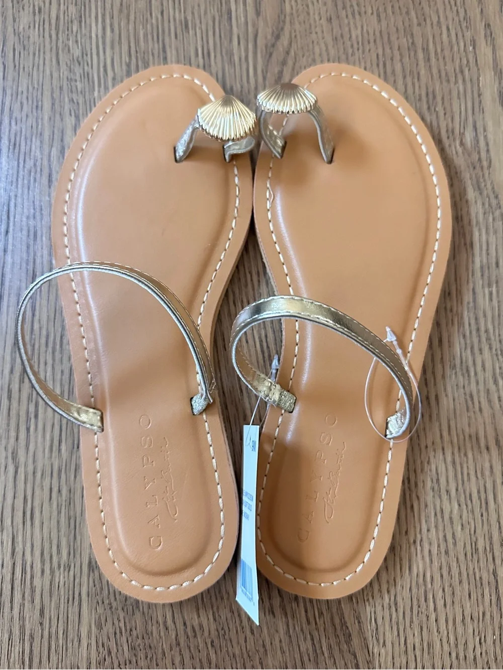 NWT. Calypso St. Barth Gold Shell-Toe Toe-Loop Sandals with Tan Footbed size 9M